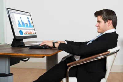 Wide photograph of a tidy desk with soft daylight across the surface